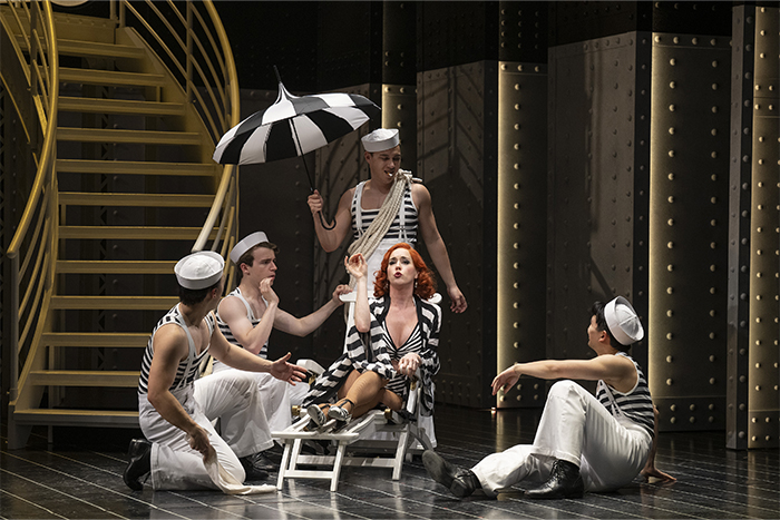 Kristi Frank as Erma Latour with (l to r) Graeme Kitagama, Émon Stocks, Leslie Garcia Bowman and Taran Kim as Sailors (Shaw Festival, 2025). Photo by David Cooper.