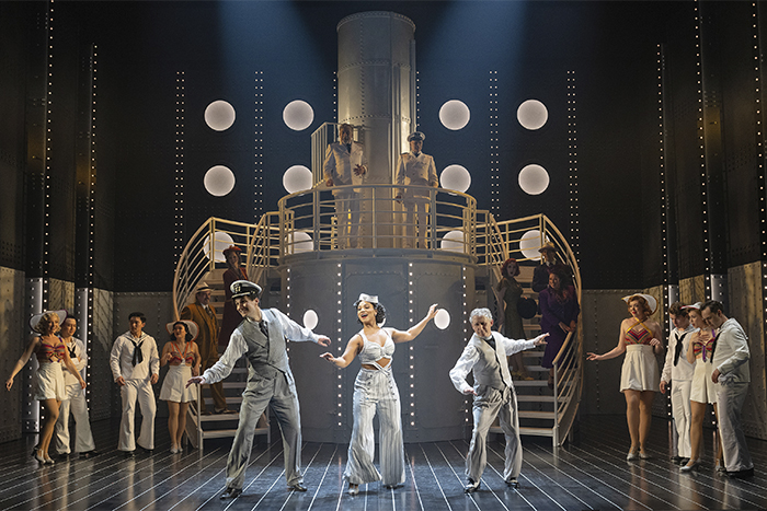l to r: Jeff Irving as Billy Crocker, Mary Antonini as Reno Sweeney and Michael Therriault as Moonface Martin with the cast of Anything Goes (Shaw Festival, 2025). Photo by David Cooper.